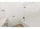 Clean bathroom with a shower/tub combo and white tile at 2181 Wateroak N Dr, Clearwater, FL 33764