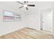 Spacious bedroom with light wood floors and double closets at 2181 Wateroak N Dr, Clearwater, FL 33764
