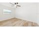 Bright bedroom with wood-look floors and ceiling fan at 2181 Wateroak N Dr, Clearwater, FL 33764