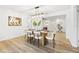 Spacious dining area with modern light fixture and seating for six at 2181 Wateroak N Dr, Clearwater, FL 33764