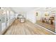 Open concept dining room with wood floors and access to sunroom at 2181 Wateroak N Dr, Clearwater, FL 33764