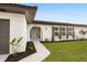 House exterior showcasing walkway and landscaping at 2181 Wateroak N Dr, Clearwater, FL 33764