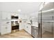 Modern kitchen with stainless steel appliances and white cabinets at 2181 Wateroak N Dr, Clearwater, FL 33764