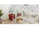 Modern living room featuring a comfortable sofa and accent chairs at 2181 Wateroak N Dr, Clearwater, FL 33764
