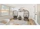 Relaxing sunroom with wicker chairs and natural light at 2181 Wateroak N Dr, Clearwater, FL 33764