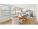 Bright sunroom with wicker chairs and large windows at 2181 Wateroak N Dr, Clearwater, FL 33764