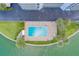 Community pool and surrounding patio area, perfect for relaxation at 240 Sand Key Estates Dr # 213, Clearwater, FL 33767