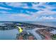 Aerial view of waterfront condo building with boat slips and pool at 240 Sand Key Estates Dr # 213, Clearwater, FL 33767