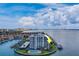 Waterfront condo building with pool and tennis courts at 240 Sand Key Estates Dr # 213, Clearwater, FL 33767