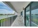 Balcony with water views and outdoor seating at 240 Sand Key Estates Dr # 213, Clearwater, FL 33767