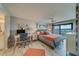 Main bedroom with water view, workspace, and coastal decor at 240 Sand Key Estates Dr # 213, Clearwater, FL 33767