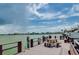 Enjoy the view from this community dock with picnic tables and benches at 240 Sand Key Estates Dr # 213, Clearwater, FL 33767