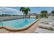 Enjoy this sparkling community pool with ample lounge chairs at 240 Sand Key Estates Dr # 213, Clearwater, FL 33767