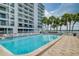 Relax by the refreshing community pool with plenty of lounge chairs at 240 Sand Key Estates Dr # 213, Clearwater, FL 33767
