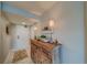 Bright entryway with a wooden console table and coastal decor at 240 Sand Key Estates Dr # 213, Clearwater, FL 33767