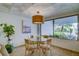 Bright lobby with a glass-top table and four chairs at 240 Sand Key Estates Dr # 213, Clearwater, FL 33767