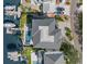 Aerial view of waterfront home featuring a backyard swimming pool, putting green and boat dock at 2502 S Dundee St, Tampa, FL 33629