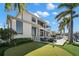 Backyard featuring a putting green, seating area, swimming pool, and waterfront views at 2502 S Dundee St, Tampa, FL 33629