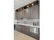 Stylish bar area with modern cabinetry, stainless steel appliances, and unique backsplash at 2502 S Dundee St, Tampa, FL 33629