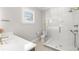 Bathroom featuring a clear glass walk-in shower and modern fixtures at 2502 S Dundee St, Tampa, FL 33629
