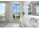 Stylish bathroom features a large window with a scenic waterfront view and double vanity sinks at 2502 S Dundee St, Tampa, FL 33629