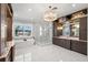 Bright bathroom featuring a soaking tub, walk-in shower, and custom cabinetry at 2502 S Dundee St, Tampa, FL 33629