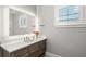 Bathroom vanity with a large mirror and modern fixtures at 2502 S Dundee St, Tampa, FL 33629