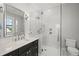 Modern bathroom features a glass enclosed walk-in shower and marble countertops at 2502 S Dundee St, Tampa, FL 33629