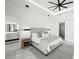 Bedroom featuring modern decor, ensuite bathroom, and a sliding barn door for flexible space options at 2502 S Dundee St, Tampa, FL 33629