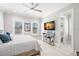 Bright bedroom with luxury vinyl flooring and a flat screen television at 2502 S Dundee St, Tampa, FL 33629