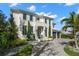 Gorgeous two-story home with meticulously landscaped front yard, and black accents at 2502 S Dundee St, Tampa, FL 33629