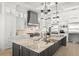Elegant kitchen featuring a marble island, chef's appliances, and stylish lighting at 2502 S Dundee St, Tampa, FL 33629