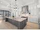 Gourmet kitchen with a large island, stainless steel appliances, and custom cabinetry at 2502 S Dundee St, Tampa, FL 33629