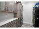 Spacious laundry room with modern appliances, custom cabinetry, and ample counter space for convenience at 2502 S Dundee St, Tampa, FL 33629