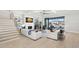 Spacious living room with fireplace, modern staircase, and water view at 2502 S Dundee St, Tampa, FL 33629