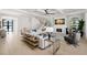 Spacious living room featuring a fireplace, modern decor, and ample natural light at 2502 S Dundee St, Tampa, FL 33629