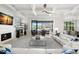 Bright living room with fireplace, waterfront views, and coffered ceilings at 2502 S Dundee St, Tampa, FL 33629
