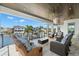 Stunning covered patio overlooking a serene waterfront, complete with comfortable seating and stylish decor at 2502 S Dundee St, Tampa, FL 33629