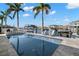 Beautiful pool surrounded by lounge chairs that overlooks a canal and boat dock at 2502 S Dundee St, Tampa, FL 33629