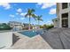 Backyard pool with steps, waterway views, and palm trees for a resort-like feel at 2502 S Dundee St, Tampa, FL 33629