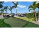 Putting green with boat dock, water, and beautiful outdoor seating at 2502 S Dundee St, Tampa, FL 33629