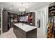 Spacious walk-in closet featuring custom shelving, ample storage, and stylish lighting at 2502 S Dundee St, Tampa, FL 33629