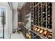Custom wine cellar with extensive storage, display racks, and ambient lighting at 2502 S Dundee St, Tampa, FL 33629