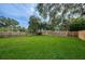 Spacious backyard with lush green grass and wooden fence at 2511 Quincy S St, St Petersburg, FL 33711