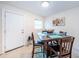 Dining room features a table with four chairs and access to exterior at 2511 Quincy S St, St Petersburg, FL 33711