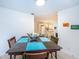 Dining room with a dark wood table and blue placemats at 2511 Quincy S St, St Petersburg, FL 33711