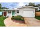 House exterior showcasing a green door and driveway at 2511 Quincy S St, St Petersburg, FL 33711
