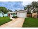 House exterior showcasing a green door and driveway at 2511 Quincy S St, St Petersburg, FL 33711