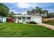 House exterior showcasing a green door and driveway at 2511 Quincy S St, St Petersburg, FL 33711