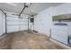Garage with washer, dryer, and additional storage space at 2511 Quincy S St, St Petersburg, FL 33711